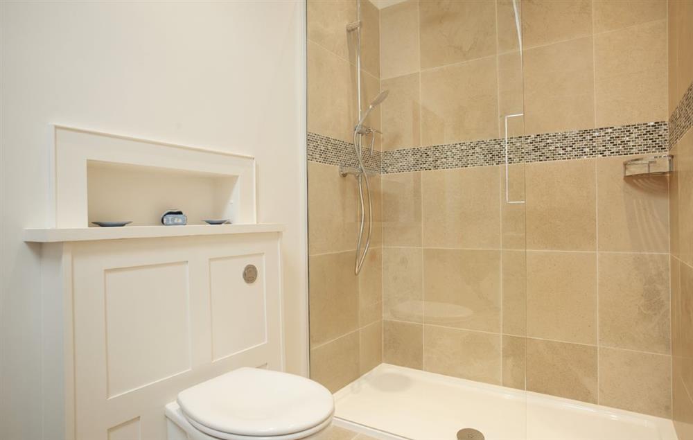 Croglin en-suite bathroom with bath and separate rainfall shower at Glen Bank, Appleby-in-Westmoreland