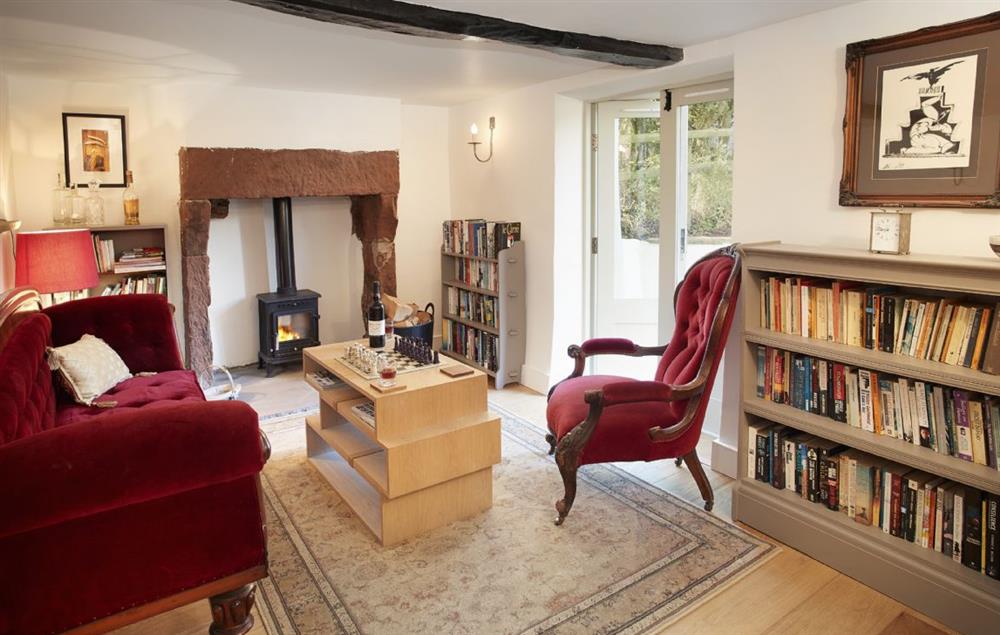 The cosy Library with wood burning stove at Glen Bank, Appleby-in-Westmoreland