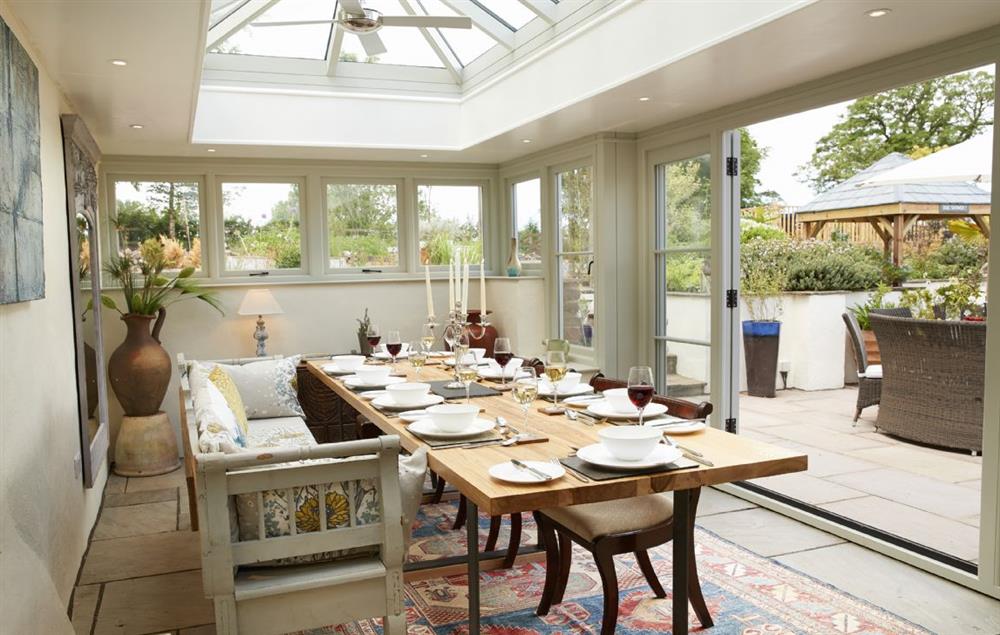 The impressive Orangery brings the outdoors in with large bi-fold doors that open on to the garden and courtyard