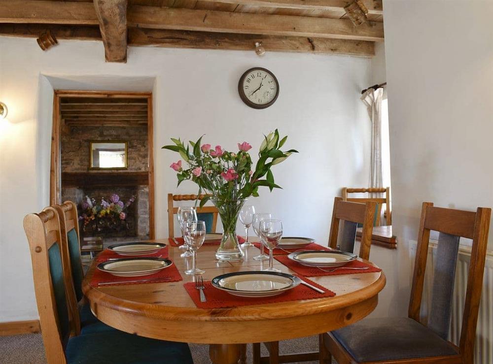 Dining area with beamed ceiling at Glen Cottage in Marstow, near Ross-On-Wye, Herefordshire