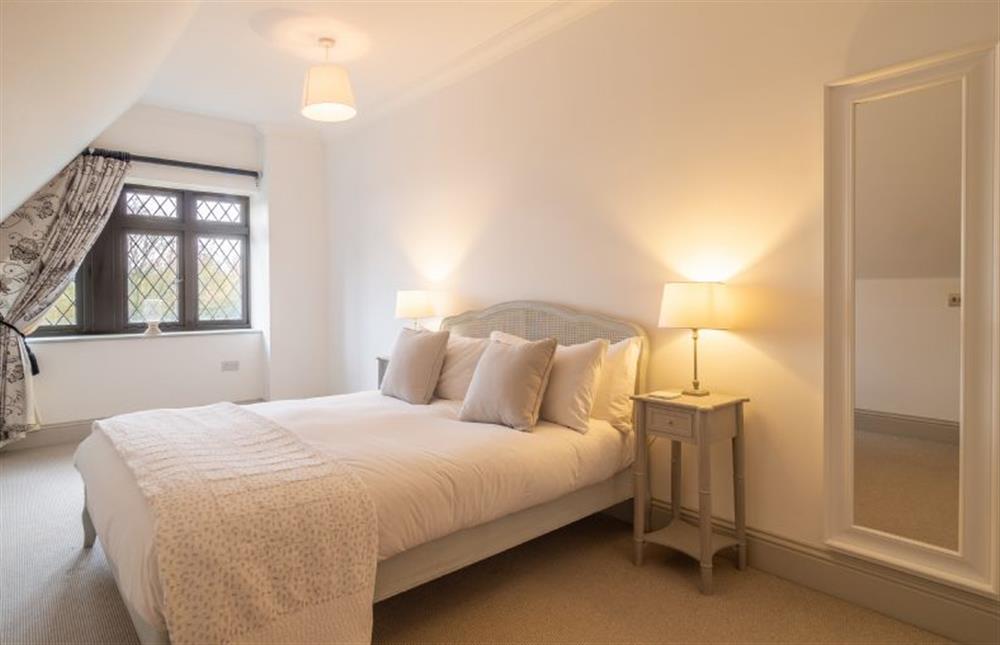 Bedroom four with 5’ king-size bed at Glencairn House, Thorpeness