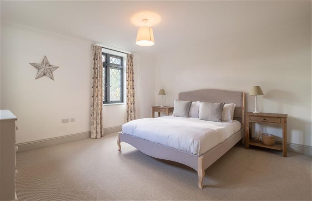 Bedroom one with 5’ king-size bed at Glencairn House, Thorpeness