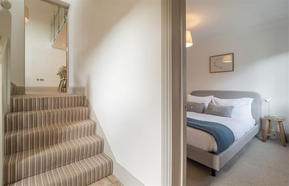 Stairs to living area and views of bedroom two at Glencairn House, Thorpeness