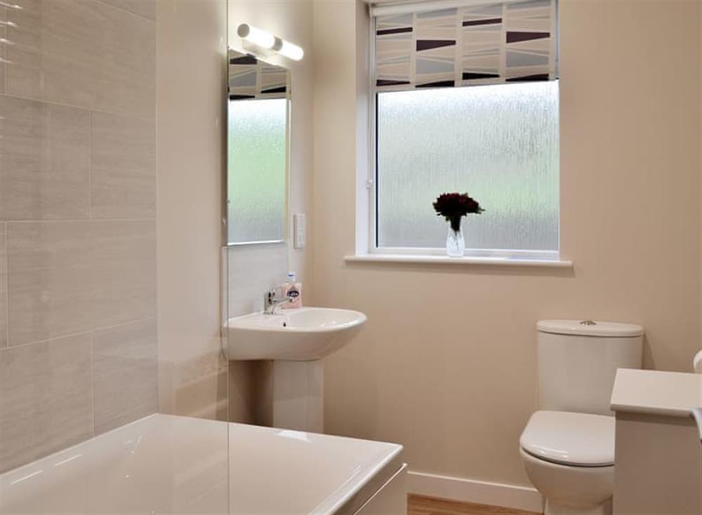 Family bathroom with shower over bath at Braemorlich, 