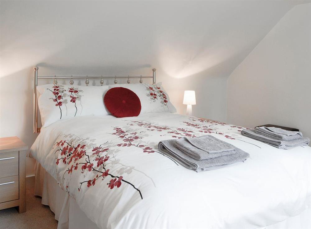 Stylish bedroom with king-size bed at Brow Cottage, 