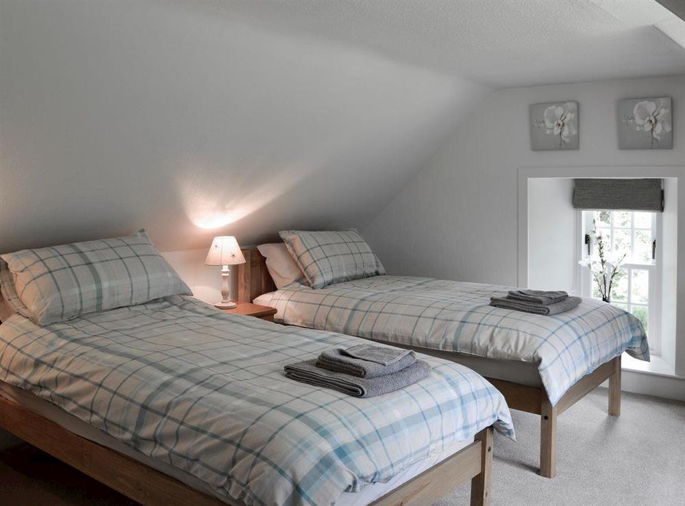 Tranquil bedroom with twin beds at Brow Cottage, 