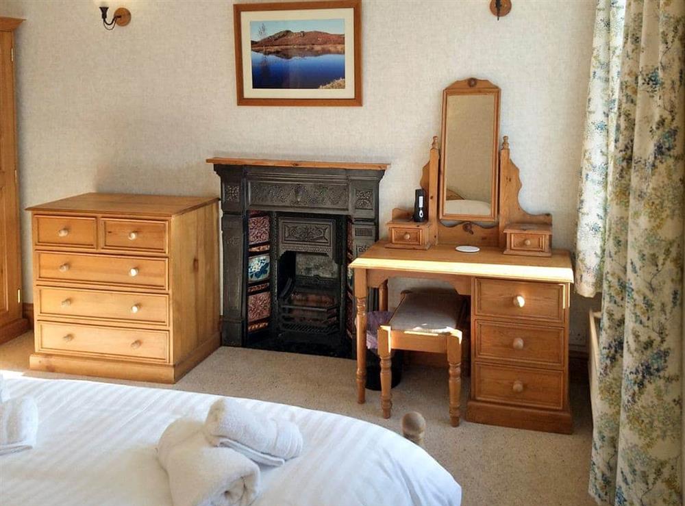 Ample storage and dressing area within double bedroom at Glenmore Cottage in Ambleside, Cumbria
