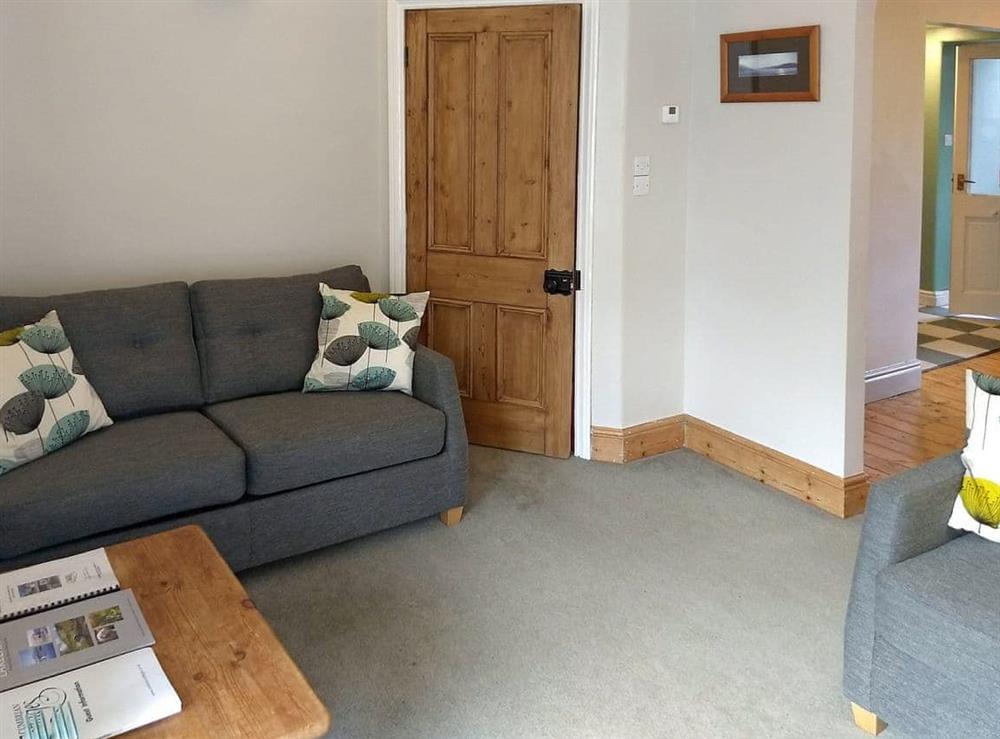 Comfy seating within living room at Glenmore Cottage in Ambleside, Cumbria