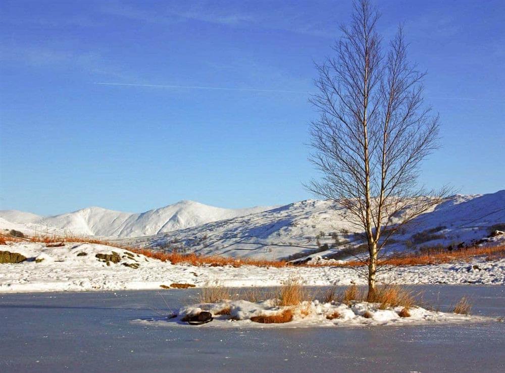 Picturesque Lily Tarn in winter at Glenmore Cottage in Ambleside, Cumbria