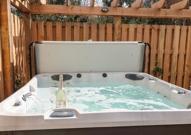 There is a hot tub (photo 2) at Gloccamaura, Bovey Tracey