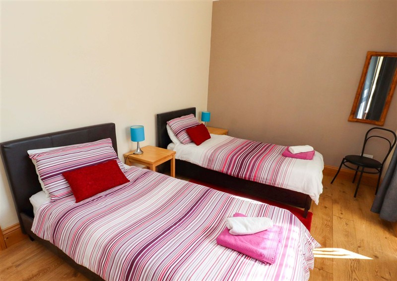 A bedroom in Godetia Cottage at Godetia Cottage, Seahouses