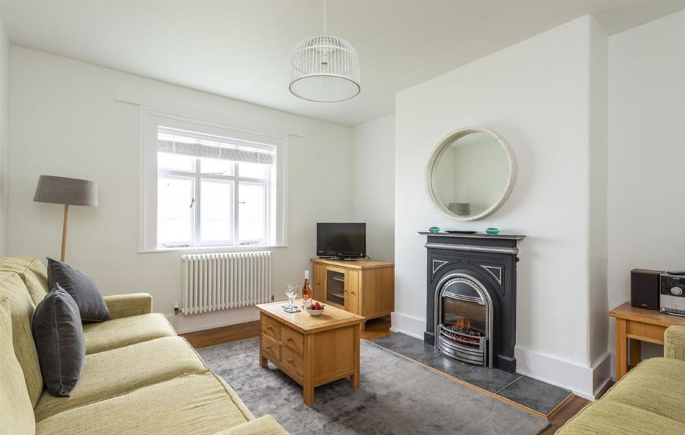 Ground floor: Sitting room with electric wood burning stove effect fire
