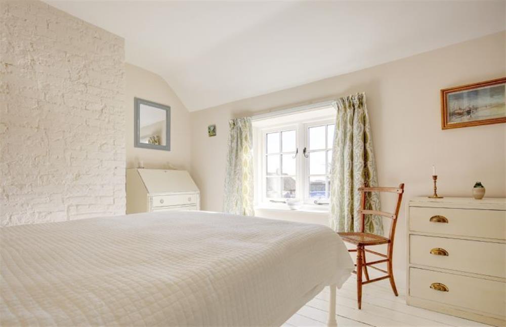First floor: Fresh bedroom with views towards the marshes at Goldfinch Cottage, Burnham Norton near Kings Lynn