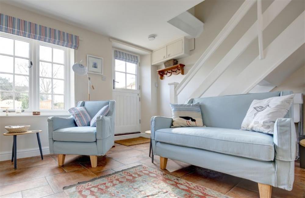 Ground floor: Comfortable seating in front of the wood burning stove at Goldfinch Cottage, Burnham Norton near Kings Lynn