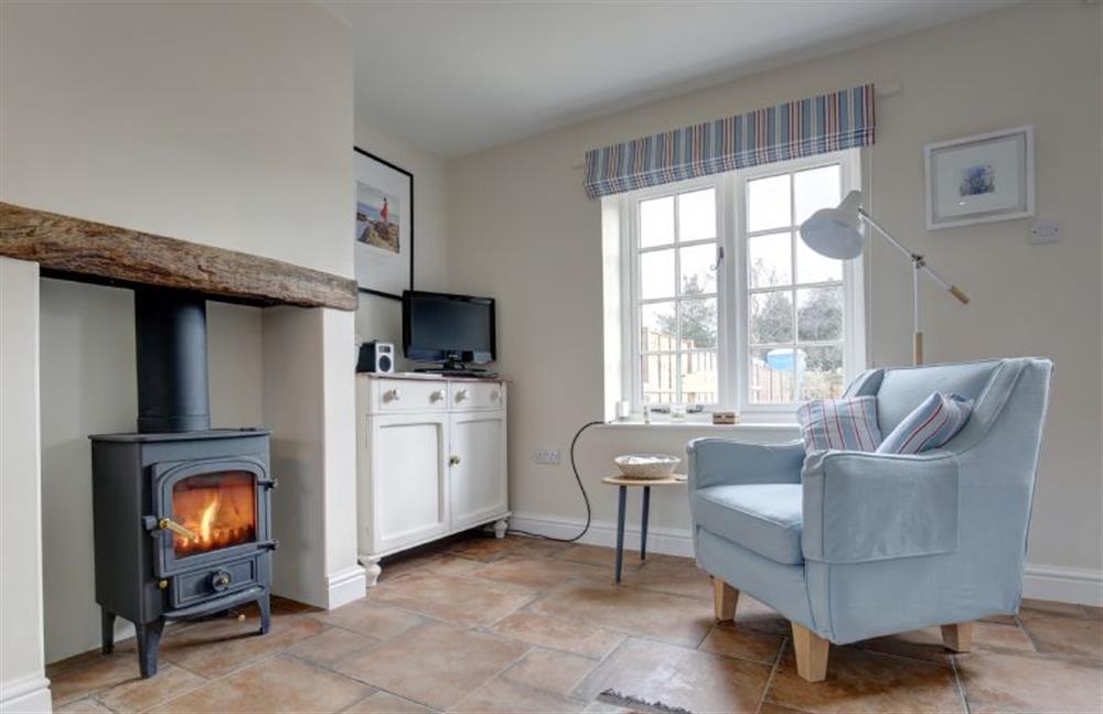 Ground floor: Relax in front of the wood burning stove at Goldfinch Cottage, Burnham Norton near Kings Lynn
