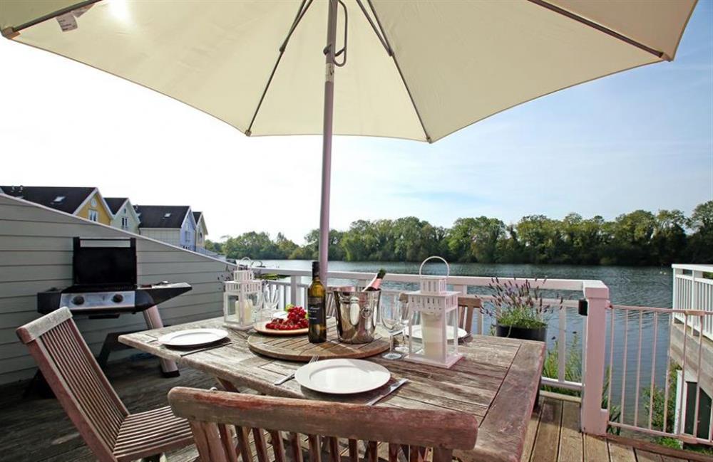 Lunch on the decked area at Goosander Lake House, Cotswold Lakes, Gloucestershire