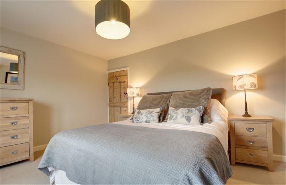 First floor: Master bedroom with king-size bed (photo 2) at Goose Cottage, Titchwell near Kings Lynn