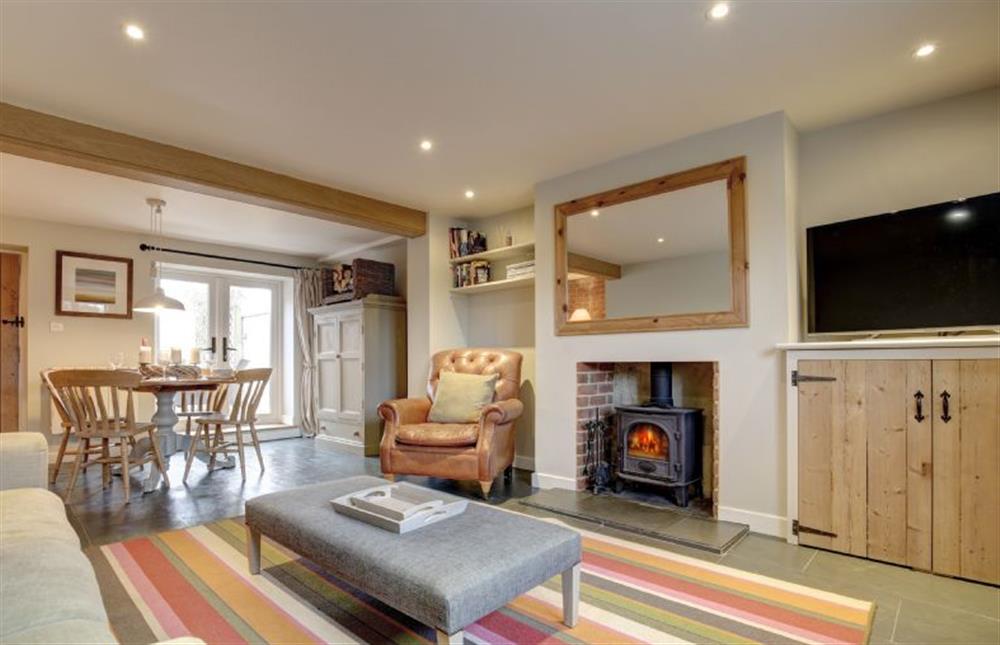Ground Floor: Cosy sitting room featuring a log burner  (photo 2) at Goose Cottage, Titchwell near Kings Lynn