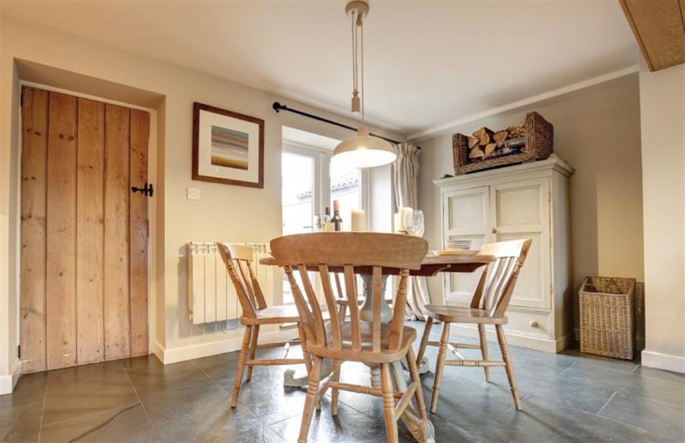 Ground floor: Dining room with kitchen door on left at Goose Cottage, Titchwell near Kings Lynn