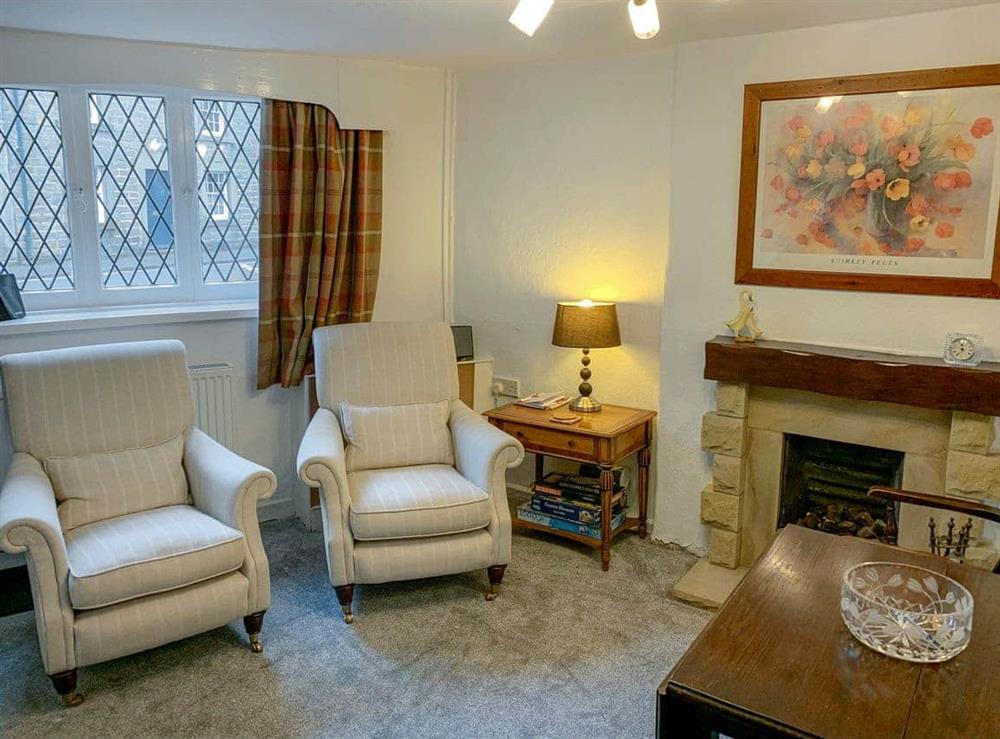 Cosy living/dining room at Goose Green Cottage in Baslow, near Bakewell, Derbyshire