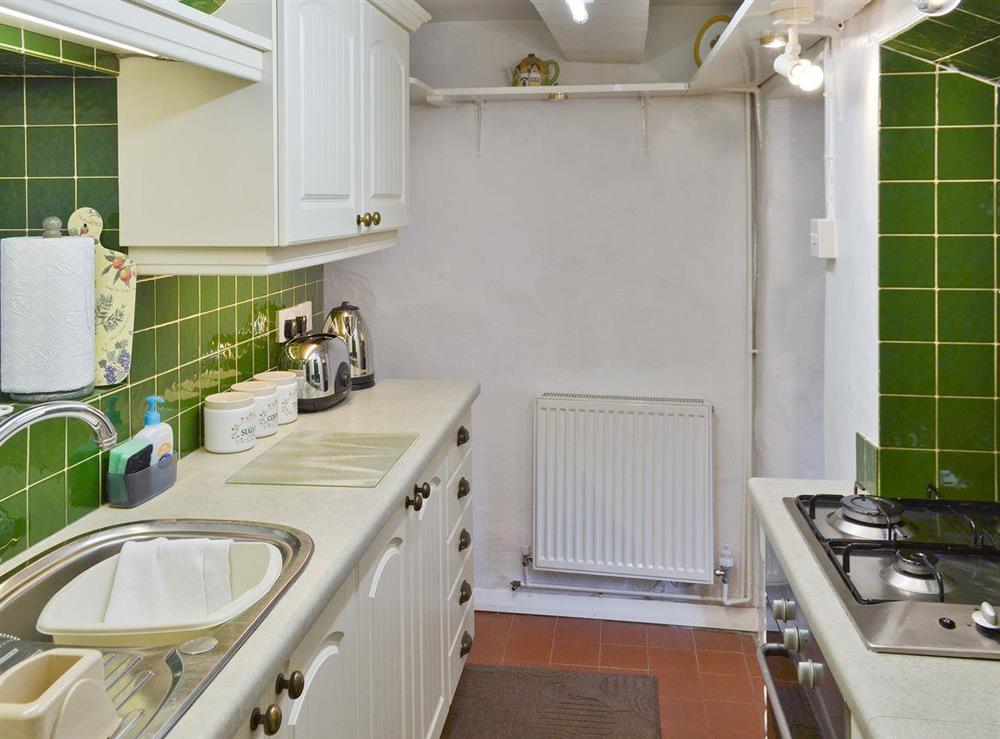 Galley-style kitchen at Goose Green Cottage in Baslow, near Bakewell, Derbyshire