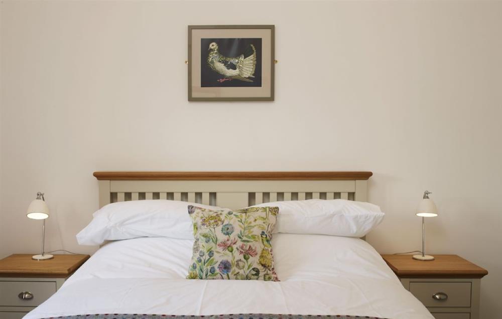 Double bedroom with king size bed and en suite walk in rain shower at Goose Run Cottage, Corscombe