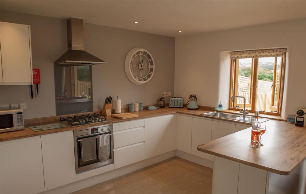 Open-plan fully fitted kitchen with views at Goose Run Cottage, Corscombe