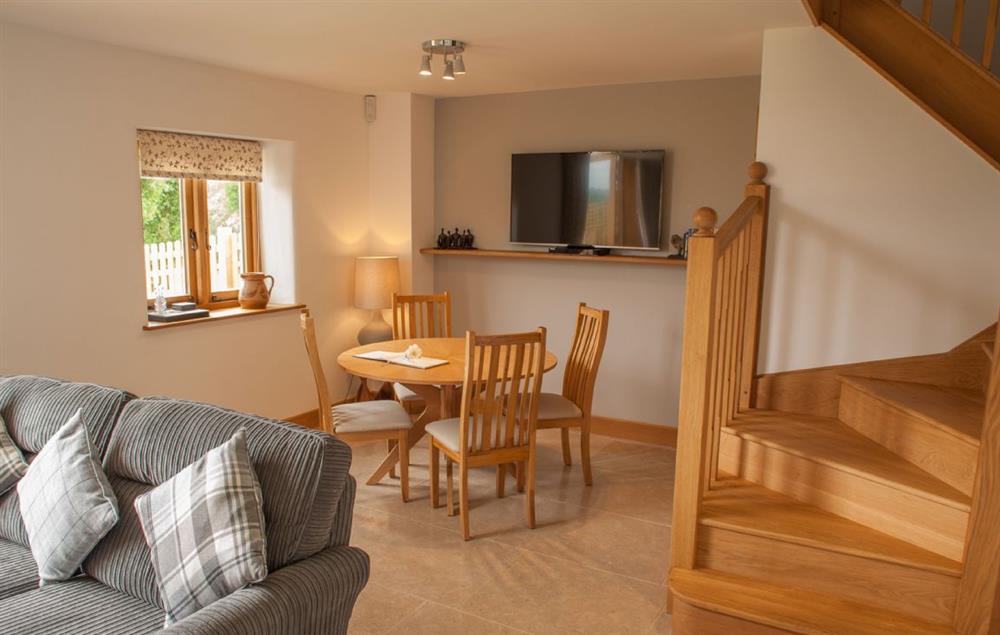 The open plan sitting and dining room with underfloor heating at Goose Run Cottage, Corscombe