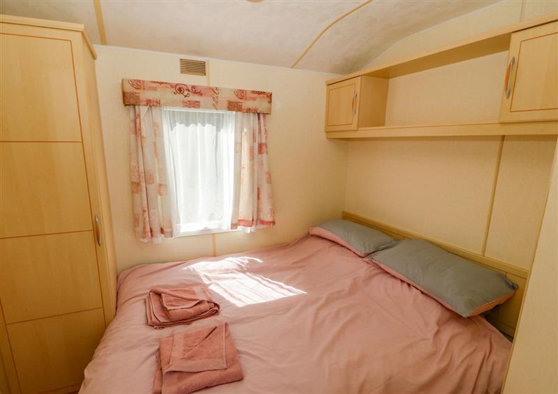 A bedroom in Gorphwysfa Caravan at Gorphwysfa Caravan, Tregele near Cemaes Bay