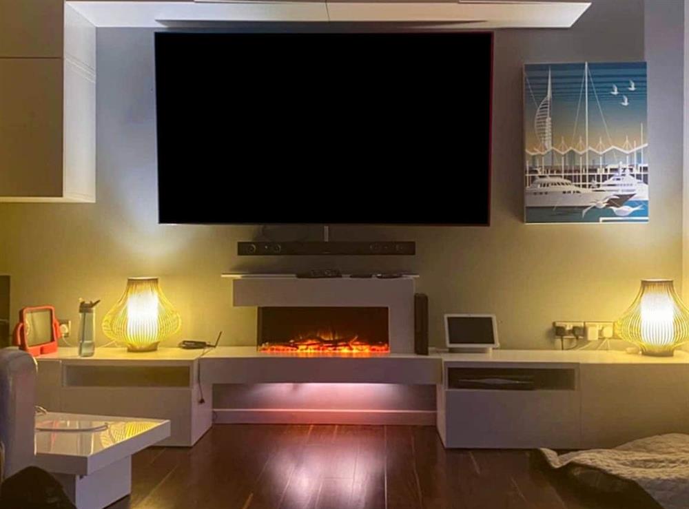 Living room with 65 inches smart TV at Gorsehill House in Poole, Dorset