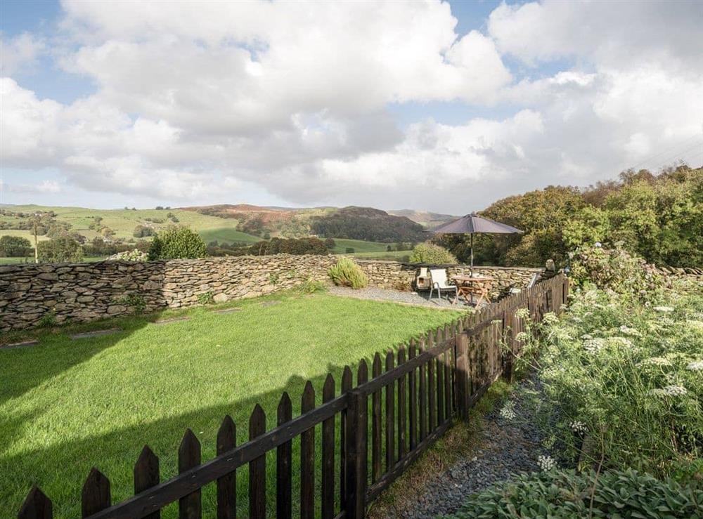 Large enclosed lawned garden at Gowan Bank Farm Cottage in Ings, near Windermere, Cumbria