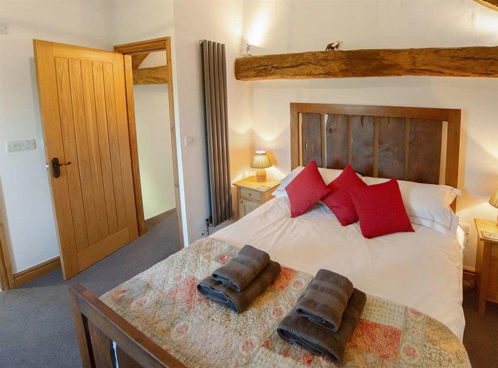 Comfortable double bedroom with en-suite at Stone Barn Cottage, 