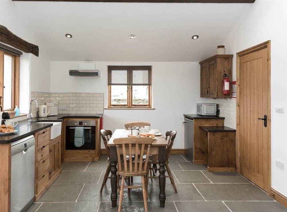 Kitchen & dining area at Stone Barn Cottage, 