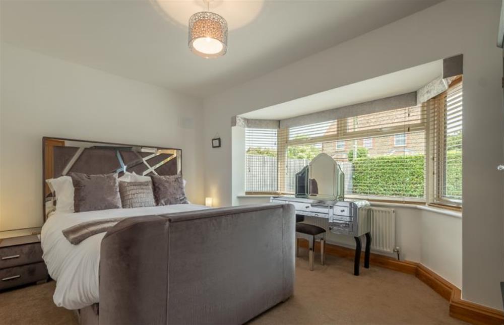 Ground floor: Bedroom two with king-size bed at Grace Cottage, Heacham near Kings Lynn