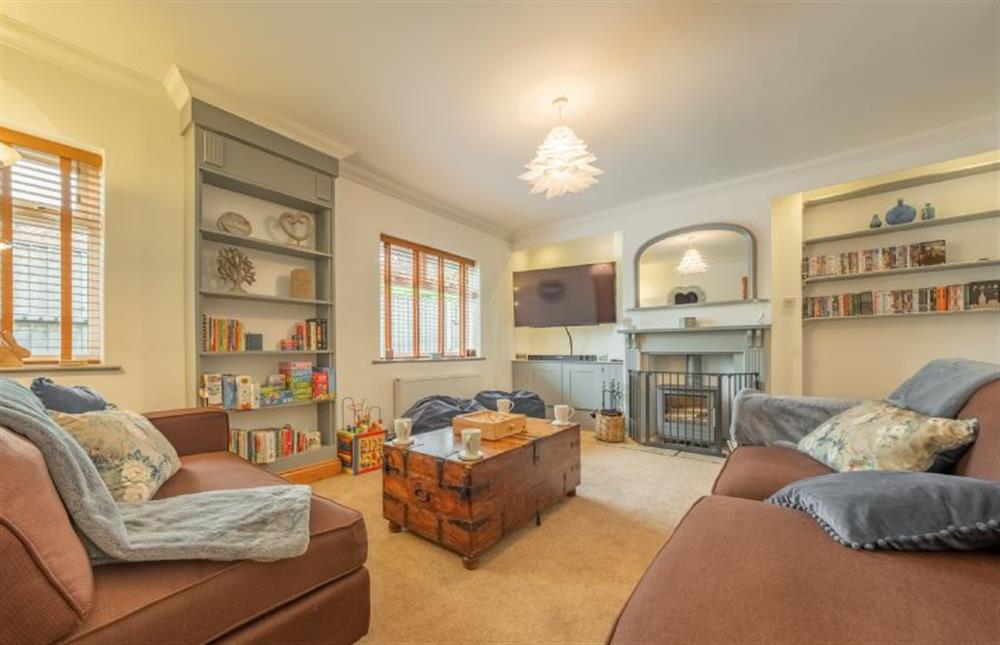 Ground floor: Family room with wood burner and full Sky entertainment package at Grace Cottage, Heacham near Kings Lynn
