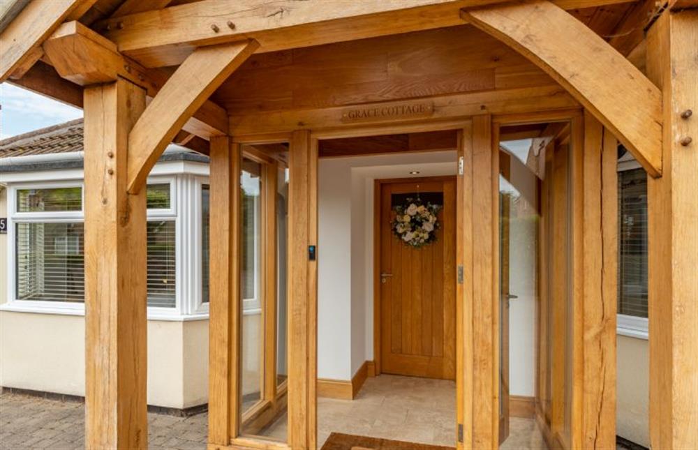 Outside: Grace Cottage benefits from an oak framed entrance porch at Grace Cottage, Heacham near Kings Lynn