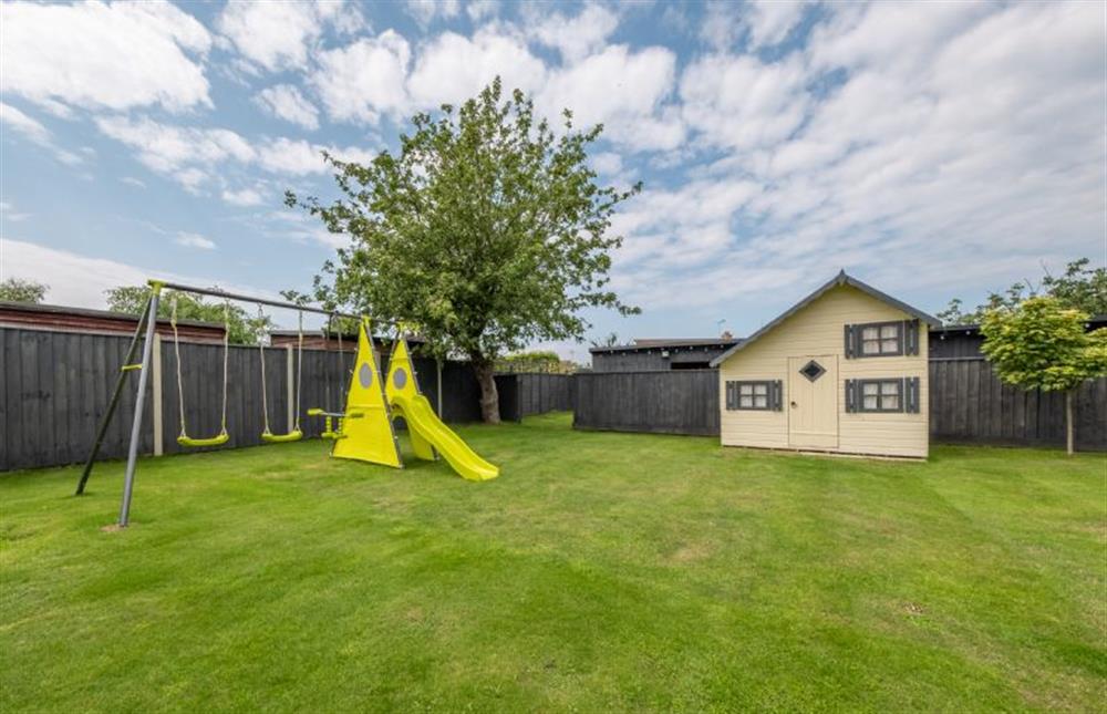 Outside: Large lawned area with Wendy house and childrenfts play equipment, perfect for the little ones