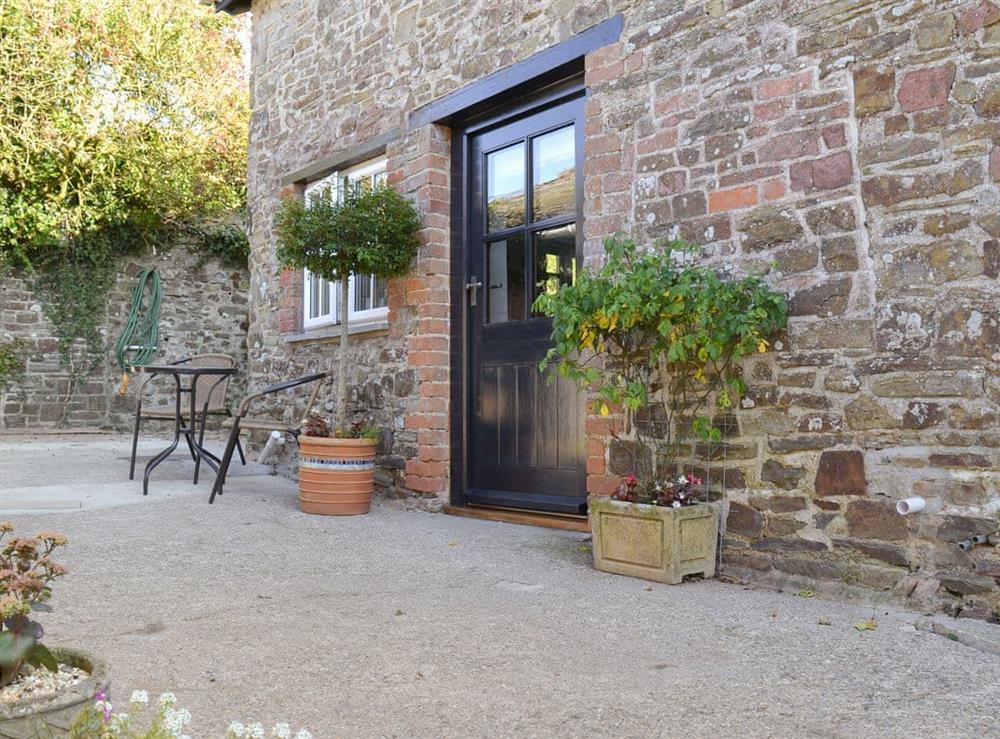 Attractive patio area with outdoor furniture at Grace Cottage in High Bickington, near Great Torrington, Devon