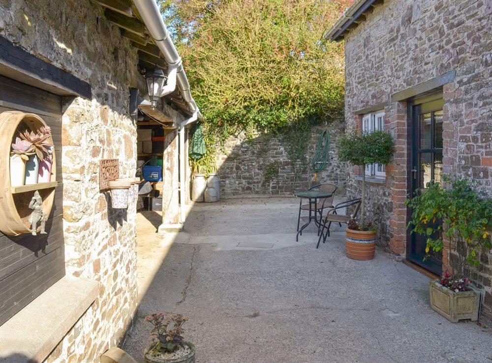 Enclosed courtyard patio area at Grace Cottage in High Bickington, near Great Torrington, Devon