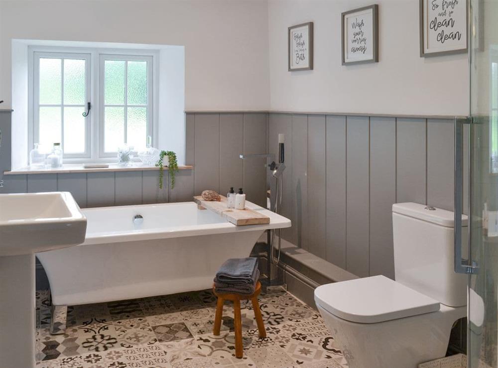 Family bathroom with bath and separate shower cubicle at Grace Cottage in High Bickington, near Great Torrington, Devon