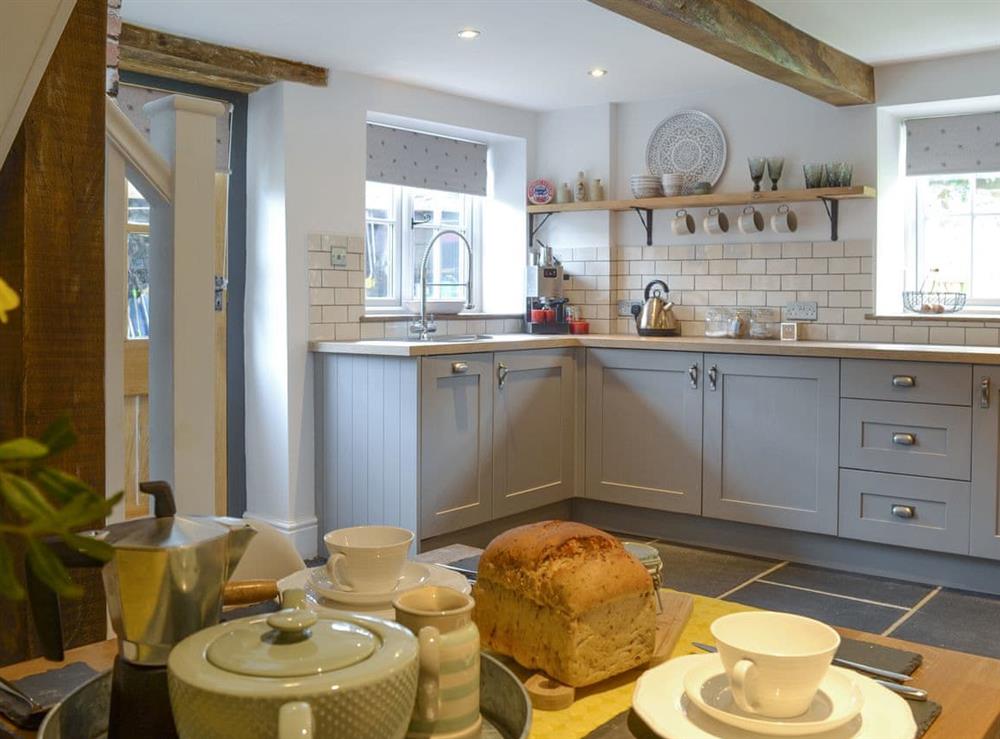Well-equipped kitchen with dining space at Grace Cottage in High Bickington, near Great Torrington, Devon