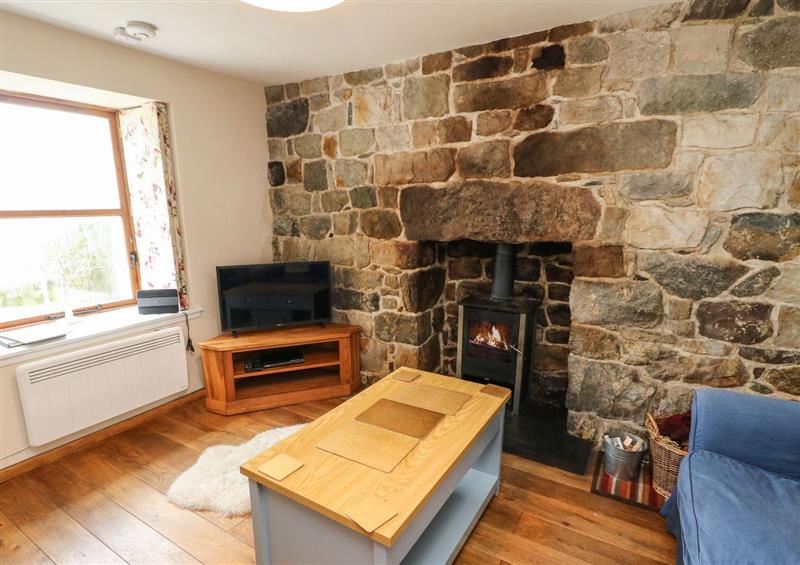 Relax in the living area at Gramarye Cottage, Peinchorran near Portree