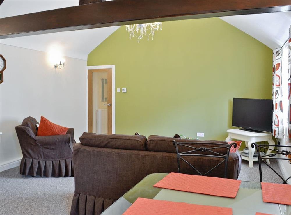 Open plan living/dining room/kitchen at Granary Cottage in Llandudno, Gwynedd