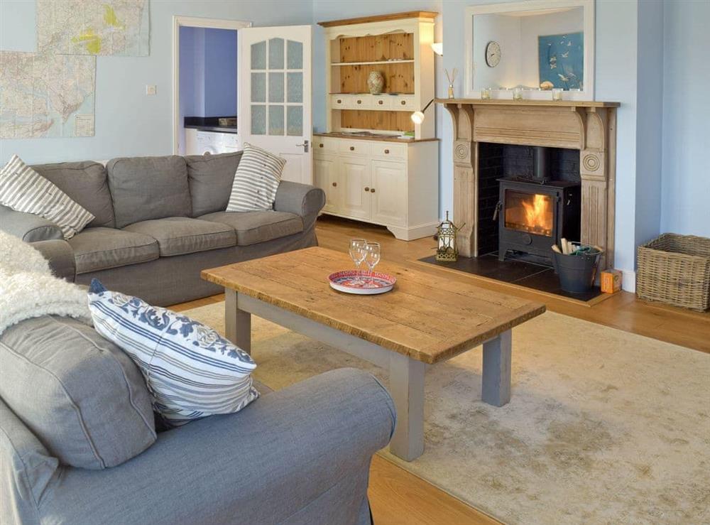 Generous lounge with wood-burner at Granary Cottage in Tattingstone, near Ipswich, Suffolk