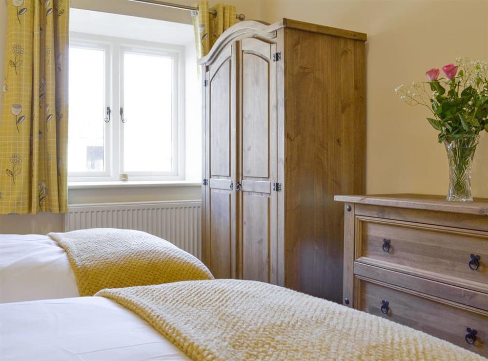 Ample storage within twin bedroom at Grange Cottage in Harome, near Helmsley, North Yorkshire