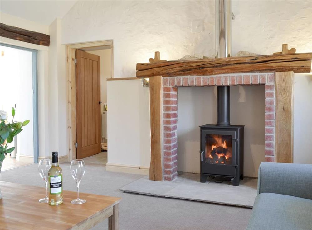 Warming wood burner at Grange Cottage in Harome, near Helmsley, North Yorkshire