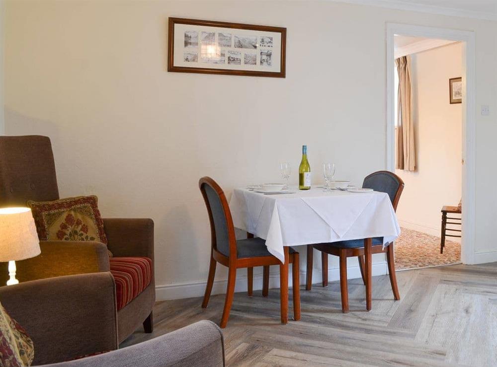 Compact dining area and comfortable armchairs at Lornas At The Grange, 