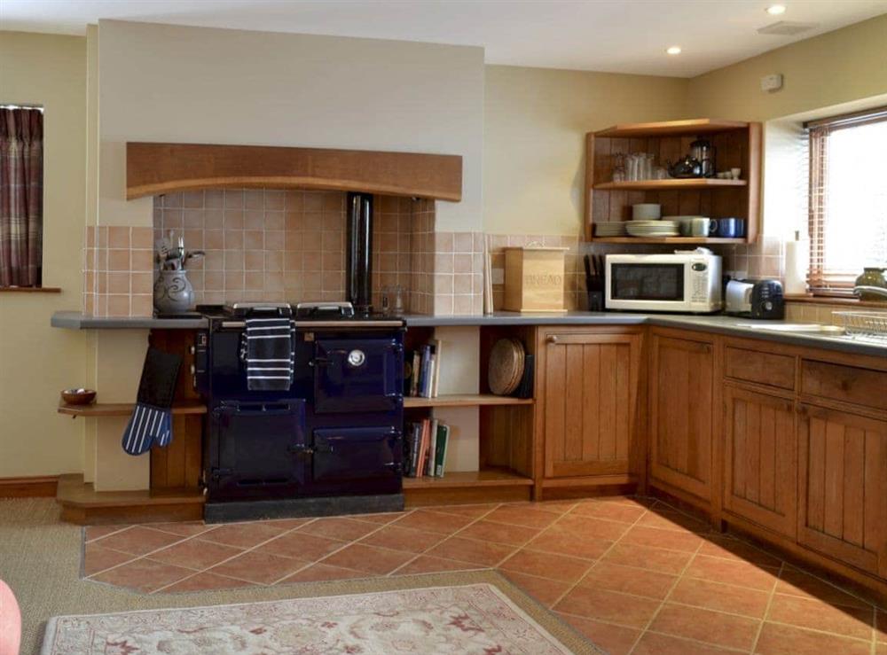 Modern fitted farmhouse-style kitchen area with Rayburn (photo 2) at Grange Farm Cottage in Spaunton, Nr Lastingham, North Yorks., North Yorkshire