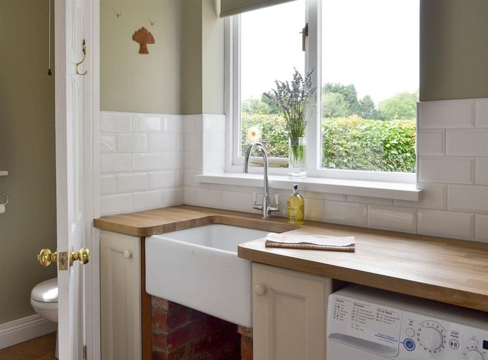 Useful utility room and ground floor toilet at Portington Lodge, 