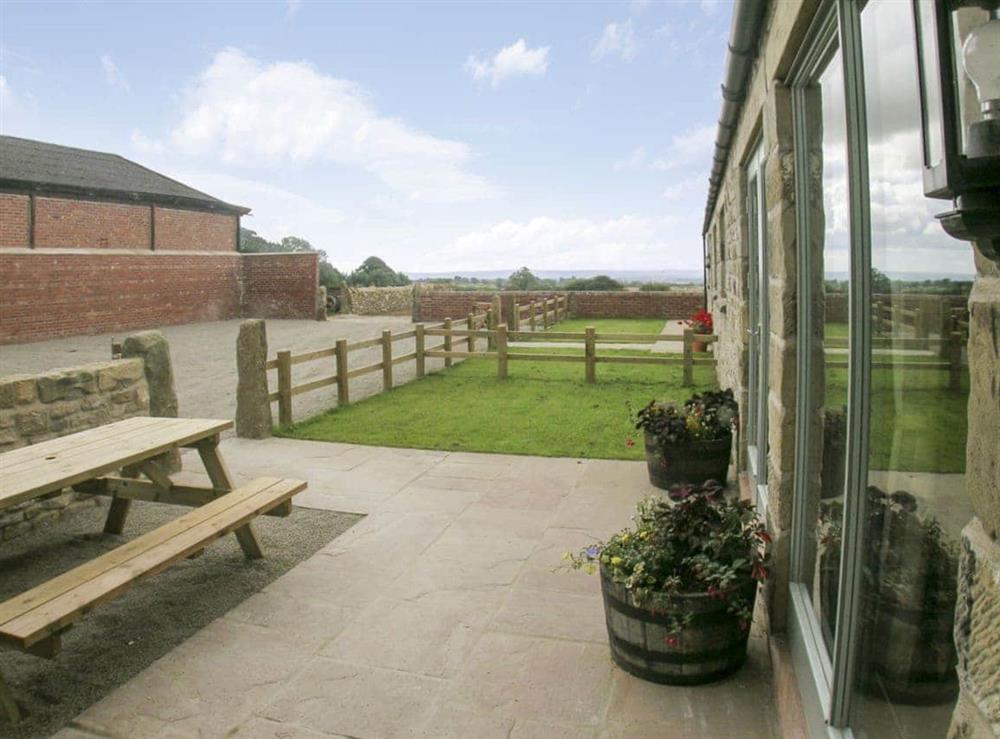 Sunny south-facing courtyard with views over Ryedale at Riccal Heads, 